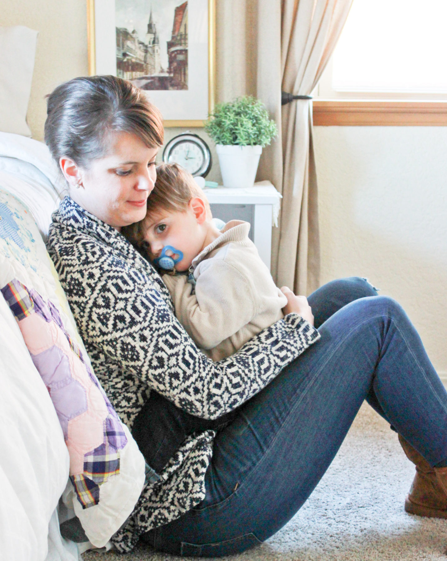 Mom snuggling boy
