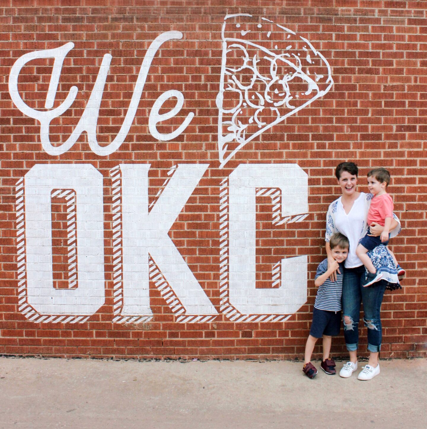 Photo of Elizabeth and her boys at Hall's Pizza downtown 