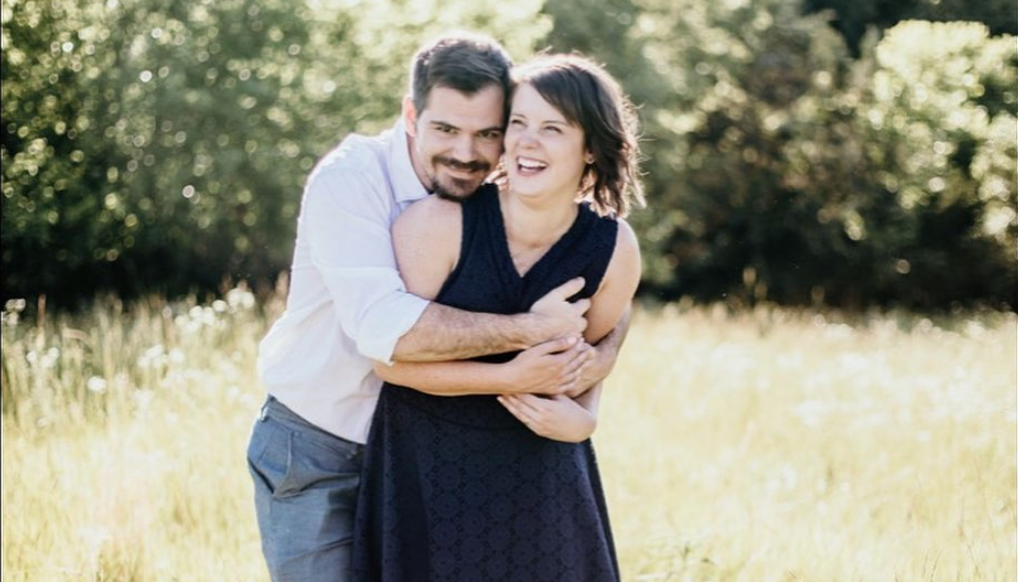 Husband and wife in a field 